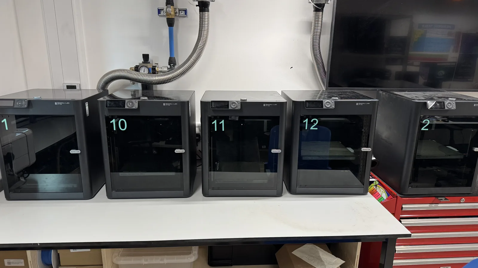 Additional Bambu Lab printers lined up in the workshop.